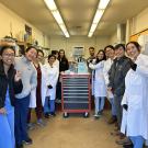 LARC members and CPL staff posing in the necropsy room looking at the camera